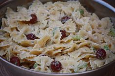 a bowl filled with pasta and vegetables on top of a table