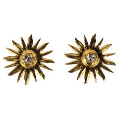 Striking Yves Saint Laurent Hammered Gold Sunburst Earrings from the late 1980's. Made by Maison Goossens with a rose cut crystal at center. Light in weight but large in scale. 2.5" across. YSL Rive Gauche. Clip back fittings. Matching Brooch available. Sunburst Jewelry, F1 Fits, Yves Laurent, Sunburst Earrings, Ysl Rive Gauche, Gold Sunburst, Golden Earrings, Chanel Vintage, Rive Gauche