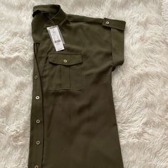 Ny&Co Brand New Army Green Blouse Army Green Size Small Gold Buttons Two Front Pockets Buttoned Cuff Sleeve 100% Polyester Green Short Sleeve Office Blouse, Chic Khaki Collared Blouse, Chic Collared Khaki Blouse, Green Short Sleeve Blouse For Office, Chic Khaki Tops For Workwear, Office Tops With Rolled Short Sleeves, Trendy Collared Khaki Blouse, Trendy Khaki Collared Blouse, Fall Short Sleeve Blouse With Rolled Sleeves