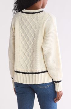 Contrast stripes enhance the preppy feel of a cozy cable-knit sweater knit in a slouchy silhouette framed by ribbed trim. 23 1/2" length V-neck Long sleeves 53% acrylic, 18% polyester, 18% nylon, 10% wool, 1% spandex Hand wash, dry flat Imported Striped Cable Knit Sweater, Chic Striped Knit Sweater, Classic Striped Knit Sweater, Striped Long Sleeve Cable Knit Sweater, Cozy White Textured Knit V-neck Sweater, Silhouette Frames, Cable Knit Sweater, Sweaters And Leggings, Sweater Knit