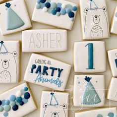 decorated cookies with blue and white frosting are arranged in the shape of polar bears