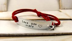 Love You More Hand Stamped Bracelet Leather by MudandRoses on Etsy, $18.00 Quotes Gift Ideas, Quote Bracelet, Custom Cuff Bracelet, Faux Leather Bracelets, Punch Ideas, Handstamped Bracelet, Bracelet Quotes, Gifts Under 25, Stamped Bracelet