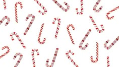 the candy canes are red and white in this seamless pattern on a white background