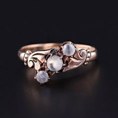 Antique Moonstone Ball Ring:  Old world elegance will be at your fingertips with this charming 10k moonstone ring (circa 1900).  The ring features a slant of three undrilled moonstone beads mounted in pale 10k rose gold.   The ring is currently a size 5.5, but it can be re-sized free of charge. It is in very good condition with minor surface wear to the moonstones. The ring weighs 1.64 grams.  We have many other fantastic offerings of period fine jewelry posted on our Etsy store, so please consider browsing our other items. We send all items in individually packaged gift boxes and offer layaway plans! + Trademark Antiques Shop Homepage https://www.etsy.com/shop/TrademarkAntiques + Our Store Policies https://www.etsy.com/shop/TrademarkAntiques/policy?ref=shopinfo_policies_leftnav + Connect Luxury Vintage Moonstone Ring Gift, Luxury Victorian Moonstone Ring Gift, Antique 14k Gold Moonstone Wedding Ring, Victorian 14k Gold Moonstone Ring For Anniversary, Victorian 14k Gold Moonstone Wedding Ring, Antique 14k Gold Moonstone Ring, Antique Moonstone Ring For Anniversary, Rose Gold Moonstone Ring With Rose Cut Diamonds, Antique Moonstone Wedding Ring