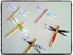 several toothbrushes with dragonflies on them are lined up in a circle and placed next to each other