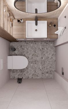 a bathroom with a sink, mirror and toilet in it's corner area is shown from above