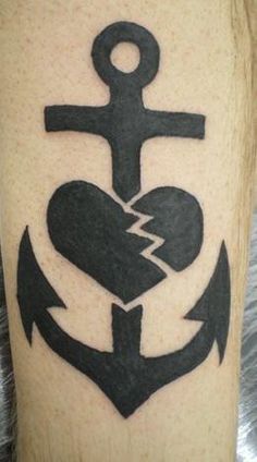 an anchor and heart tattoo on the leg