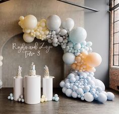 balloons and candles are arranged on the floor in front of a sign that reads raffia and lynn fair 3