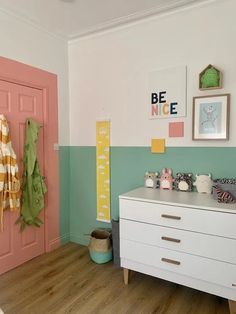 a baby's room is decorated in pastel colors