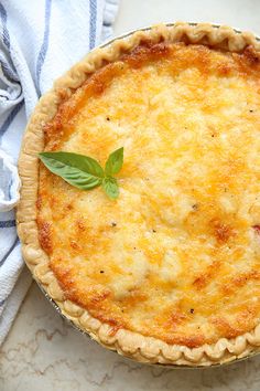 a cheese pie with a leaf on top