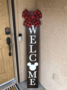 a welcome sign with a bow on it