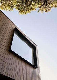 a window on the side of a wooden building