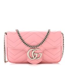 This is an GUCCI Calfskin Matelasse Super Mini GG Marmont Shoulder Bag in Wild Rose.This shoulder bagis crafted of smooth and supple chevron quilted pastel pink calfskin leather. This crossbody bag features an optional silver chainshoulder strap. The crossover flaphas a silver GG logo and opens to a beige microfiber interior with a removable key chain. Gucci Marmont Bag, Gucci Crossbody Bag, Gucci Crossbody, Chevron Quilt, Gg Logo, Gucci Shoulder Bag, Gg Marmont, Bag Light, Wild Rose