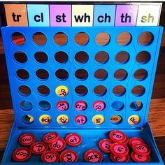 a blue board game with numbers and letters on it