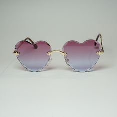 Style: S5011 Shape: Cat Eye Protection: UV400 Lens Material: Plastic Eye/Bridge/Temple: 58/18/140 (mm) Love on Edge Rimless Heart Sunglasses - S5011 Actual colors may vary. This is due to the fact that every computer monitor has a different capability to display colors and that everyone sees these colors differently. We try to edit our photos to show the samples as life-like as possible, but please understand the actual color may vary slightly from your monitor. We cannot guarantee that the colo Purple Blue Ombre, Pretty Sunglasses, Frameless Sunglasses, Unique Sunglasses, Shady Lady, Ladies Gents, Black Ombre, Heart Sunglasses, Rimless Sunglasses