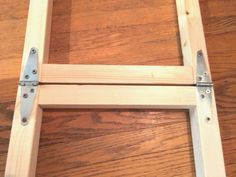 a wooden ladder sitting on top of a hard wood floor