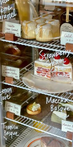 a display case filled with different types of desserts