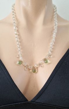 A beautiful crystal necklace from the Art Deco period with three beautiful teardrop crystal droppers in a green and pink. The necklace's beads are graduated getting smaller as they get to the back of the neck. It measures 59 cm and fastens with a secure brass screw clasp indicative of the 1920s/30s. Note: Being a vintage piece, any notable damage, missing parts or wear will be described as accurately as possible. However, minor imperfections & signs of wear should be expected. Please consider pi Teardrop Crystal Faceted Necklace, Faceted Teardrop Crystal Necklace, Green Teardrop Necklace With Faceted Beads, Teardrop Crystal Beaded Necklace, Vintage Clear Crystal Necklace, Crystal Beaded Teardrop Necklace, Art Deco Period, Crystal Drop, Lovely Necklace