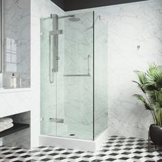 a bathroom with black and white checkered flooring, glass shower enclosure, and tiled walls