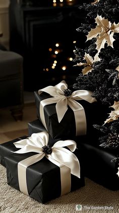 Black Christmas Decorations for a Dramatic Holiday Look - The Garden Style Black Christmas Tree Decorations, Black Christmas Decorations, Black Pillar Candles, Painted Branches, Black Wall Decor, White Pillar Candles, Elegant Coffee Table, Christmas Wreaths & Garlands, Black Christmas Trees