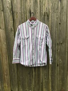 This is a great button up that isn't flashy or crazy, just simple and cool. It will look great with anything and is ready to go. It is in great condition and has no rips, holes, stains or smells. Measurements: Pit to pit: 22 1/4 inches Collar to bottom front: 23 3/4 inches Collar to bottom back: 26 inches Sleeve Length (from collar): 27 3/4 inches Size on tag: Medium 90s Style Cotton Button-up Shirt, 90s Style Cotton Shirt With Buttons, 90s Style Long Sleeve Shirt With Button Closure, 90s Style Collared Shirt With Button Closure, Biker Shirts, Vintage Vans, Button Dress, Button Up Shirt, Denim Fashion