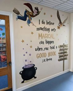 this is a wall mural in an office with harry potter quote on it and hogwart's pot