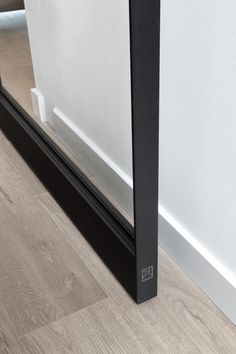 the bottom half of a door with a black frame