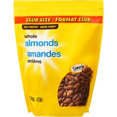 a bag of almonds sitting on top of a white table