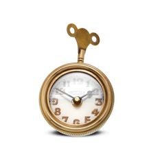 an antique clock with a key hanging from it's front end, on a white background