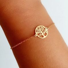 Bracelet made of 925 Sterling Silver with gold plating, decorated in its central part with a small round medal with a silhouette of the Tree of Life.  This bracelet is full of meaning and spirituality. It is an ideal gift for a friend, mother or daughter and conveys the strength of eternal connection.  The bracelet is 17 cm long and has another 3 cm extension. It is made entirely of 925 Sterling Silver and an 18-carat gold plating has been applied. ------------------------- To see more beautiful Gold Symbolic Bracelets For Everyday, Everyday Symbolic Gold Bracelets, Adjustable Gold Charm Bracelet In Sterling Silver, Elegant Yellow Gold Nickel-free Charm Bracelet, Nickel-free Gold Plated Bracelets, Gold Symbolic Charm Bracelet As Gift, Minimalist Gold Sterling Silver Bracelet As Gift, Gold Charm Bracelet Gift, Adjustable Rose Gold Sterling Silver Bracelet As Gift