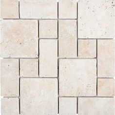 a white tile wall with square tiles on it