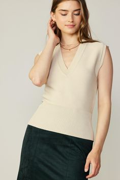 Done in a versatile beige shade, this sleeveless sweater vest is defined by a V-shaped neckline that offers space for showing off a necklace. It's knitted with horizontal ribs and a wide, figure-clinging waist. •V-neckline •Slim fit •Sleeveless •Ribbed Item number 2330015 55%VISCOSE 45%POLYESTER Beige V-neck Tank Top For Fall, Cream Ribbed V-neck Knit Top, Stretch V-neck Sweater Vest For Layering, Ribbed Vest For Fall, Elegant Sweater Vest For Spring Layering, Elegant Spring Sweater Vest For Layering, Chic V-neck Vest Knit Top, Chic V-neck Knit Vest Top, Stretch Knit V-neck Vest