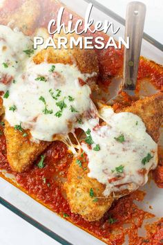 chicken parmesan in a casserole dish with sauce and parsley on top