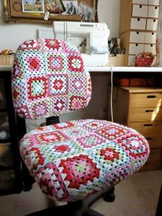 a quilted chair sits in front of a sewing machine