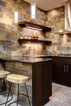 a kitchen with two stools in front of the counter