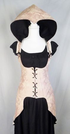 a mannequin is dressed in black and pink