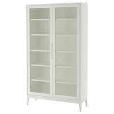 a white bookcase with glass doors on the front and bottom shelves, against a white background