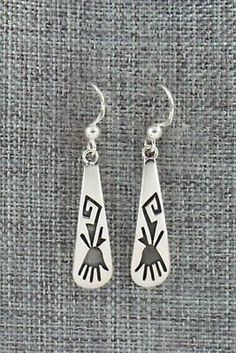 "These sterling silver earrings were made by Hopi silversmith Augustine Mowa. The back is stamped sterling. Length: 1 5/8\" Width: 1/4\" Free shipping on all orders! We ship with USPS and always include tracking. All orders ship within a day of payment. Returns are accepted up to 30 days after you receive your order. Just send us a message. Our shop offers cash back or store credit. The item must be returned in new condition." Traditional Sterling Silver Engraved Earrings, Vintage Sterling Silver Engraved Earrings, Southwestern Style Sterling Silver Drop Earrings, Southwestern Silver Earrings With Inlay, Southwestern Hand-strung Sterling Silver Jewelry, Native American Jewelry, Free Jewelry, Sterling Silver Earrings, Silver Earrings