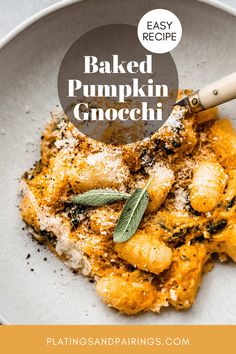 baked pumpkin gnocchi in a white bowl with sage sprigs on top