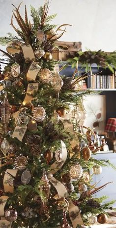 a christmas tree decorated with ornaments and ribbons