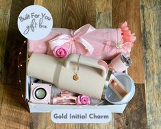 a gift box filled with personal care items on top of a wooden floor next to a sign that says, built for you