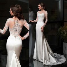 the back of a wedding dress with long sleeves