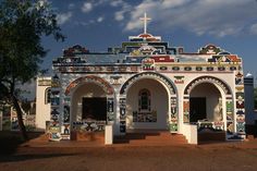 an old church with colorful decorations on it