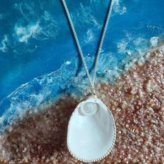 Embrace the beauty of the ocean with our handcrafted Seaside Elegance necklace, a stunning piece that captures the essence of the shore. This necklace features a natural seashell pendant, carefully selected for its unique shape and intricate patterns, paired with a lustrous freshwater pearl that adds a touch of elegance. Each necklace is lovingly handcrafted, ensuring that no two pieces are exactly alike--just like the treasures you find on the beach. The combination of organic elements and timeless pearls creates a perfect harmony, making this necklace a versatile accessory that can complement any outfit, whether you're dressing up for a special occasion or adding a touch of coastal charm to your everyday look. Features: Natural Seashell: Handpicked for its distinctive beauty, bringing th Pearl Jewelry Gift, Organic Elements, Seashell Pendants, Shell Necklaces, Intricate Patterns, Pearl Jewelry, Two Pieces, Jewelry Gift, Croatia