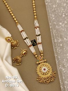 Description :- South Indian Necklace Set Bollywood Necklace Earring Set Ethnic Gold Plated Indian Wedding Jewelry Party Wear Necklace Set Gift yourself a royal look with this perfectly crafted necklace set from Manalisstudio. Crafted with high quality CZ stones, it is impressive in design. The green enamel artwork adds perfect texture to the design. Perfect for weddings and festivities, this antique necklace set should be put on with your favorite sari or lehenga. 100% Satisfaction. Long Lasting South Indian Necklace, Bollywood Necklace, Indian Necklace Set, Indian Necklace, Rainbow Wallpaper, Wear Necklaces, Gold Fashion Necklace, Indian Wedding Jewelry, Antique Necklace