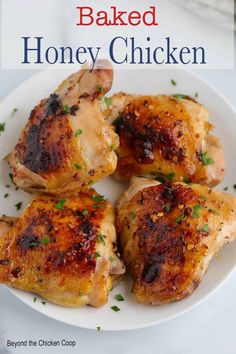 baked honey chicken on a white plate with parsley in the foreground and text overlay that reads baked honey chicken