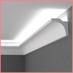 the corner of a room with a light fixture on it's ceiling and walls