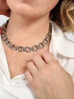 This bold geometric link choker necklace makes a striking statement with its chunky, angular chain link design. A modern silhouette with polished finishing creates an eye-catching moment that elevates any look with confidence and edge. - Stainless steel base - Length: 13" / 330.2mm + 3" / 76.2mm extender (adjustable)- Width: 0.55" / 14mm- Lobster clasp- Available in gold + silver - Engraved with signature MC branding- Hypoallergenic, non-tarnish, water-resistant Chic Metal Chain Link Choker, Chic Chain Link Metal Choker, Metal Link Choker, Chic Metal Link Choker, Gold Multi-strand Metal Choker, Zodiac Bracelet, Zodiac Pendant, Chain Link, Ring Necklace