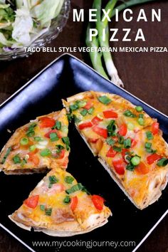 mexican pizza with vegetables on a black plate