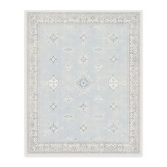 a light blue and white rug with an intricate design on the center, in front of a